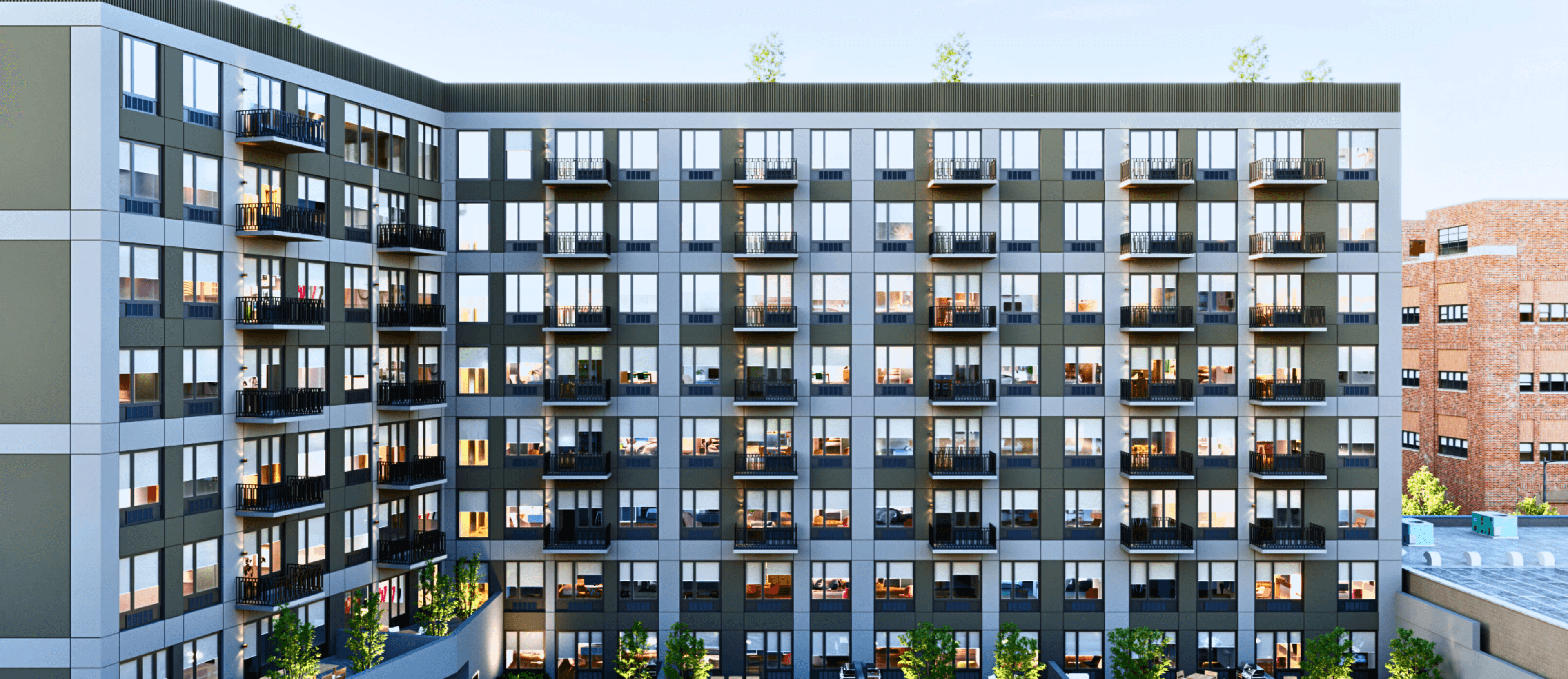 The full balconied brick facade of The Astelle along Rider Avenue in Mott Haven