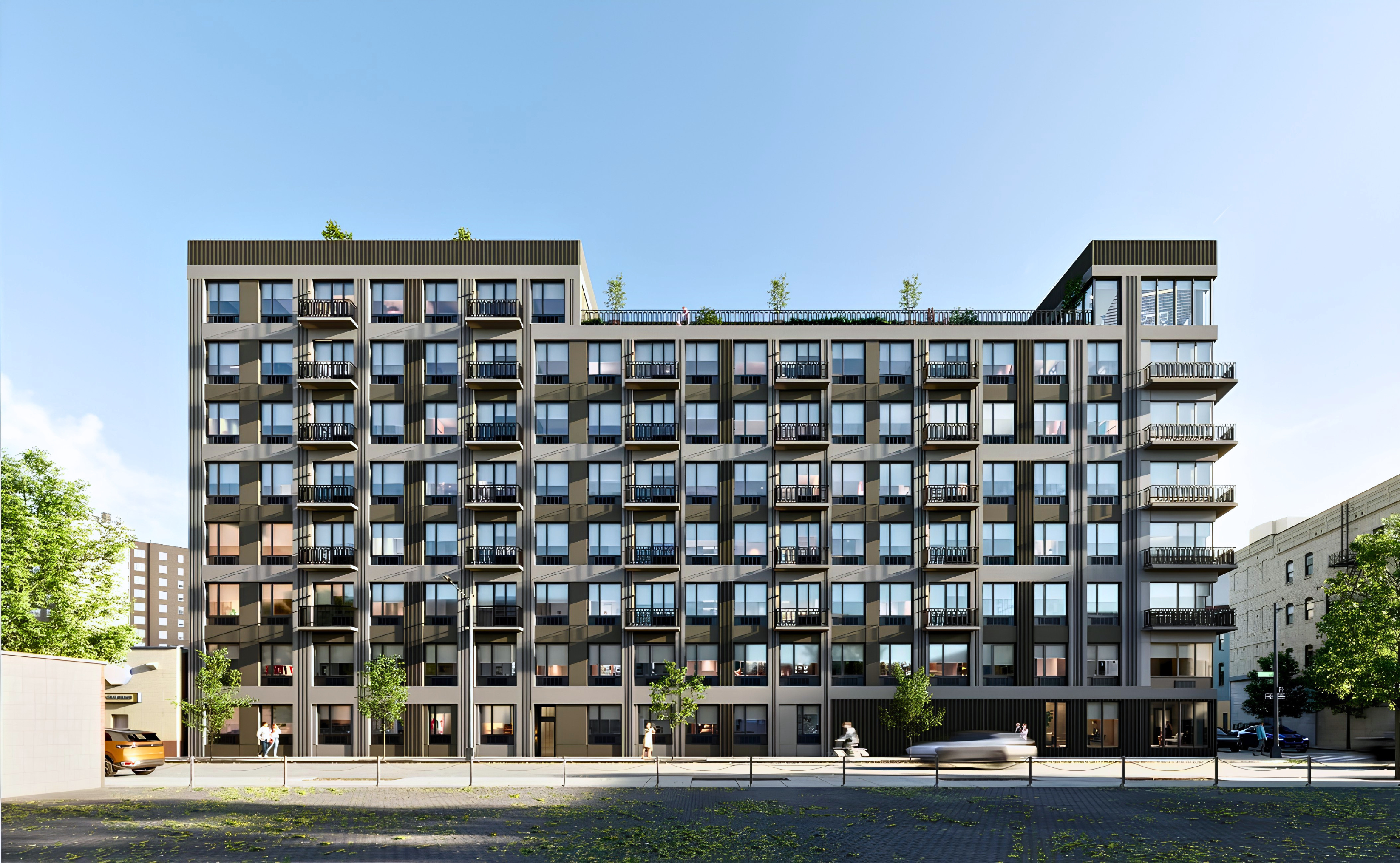 The Astelle, a 2025 building at 286 Rider Avenue in Mott Haven, the South Bronx, its eight-story balconied exterior rising against a clear sky